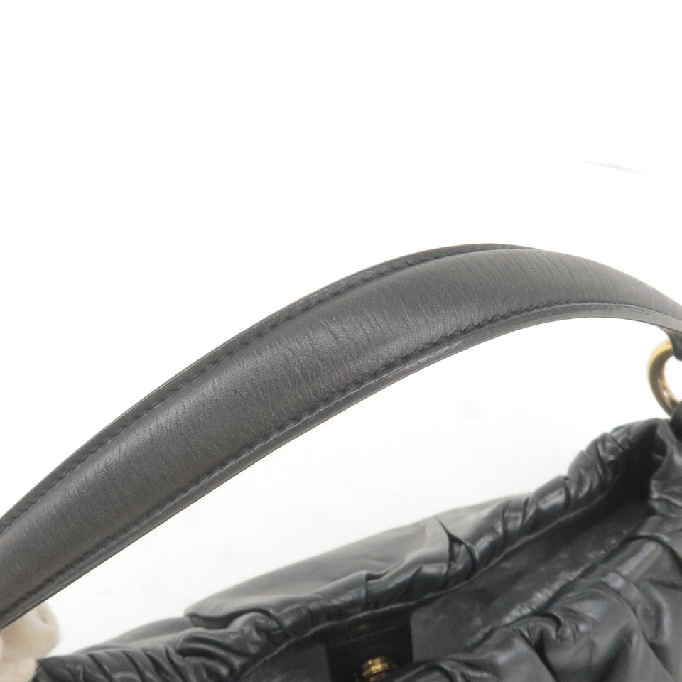 Prada Logo Leather Shoulder Bag With Tassel Black