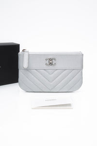 CHANEL Metallic Silver Caviar Chevron Quilted Small Mademoiselle Zip Pouch Case
