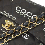 CHANEL 2001-2003 COCO patterned Classic Double Flap Medium Black Canvas