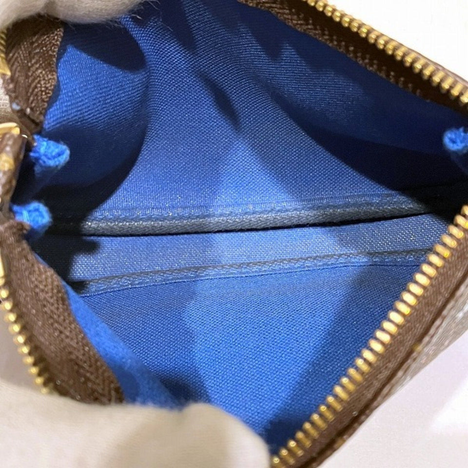 Louis Vuitton Mini Pochette Accessoires  Canvas Clutch Bag