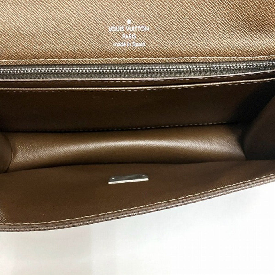 Louis Vuitton Selenga  Leather Clutch Bag