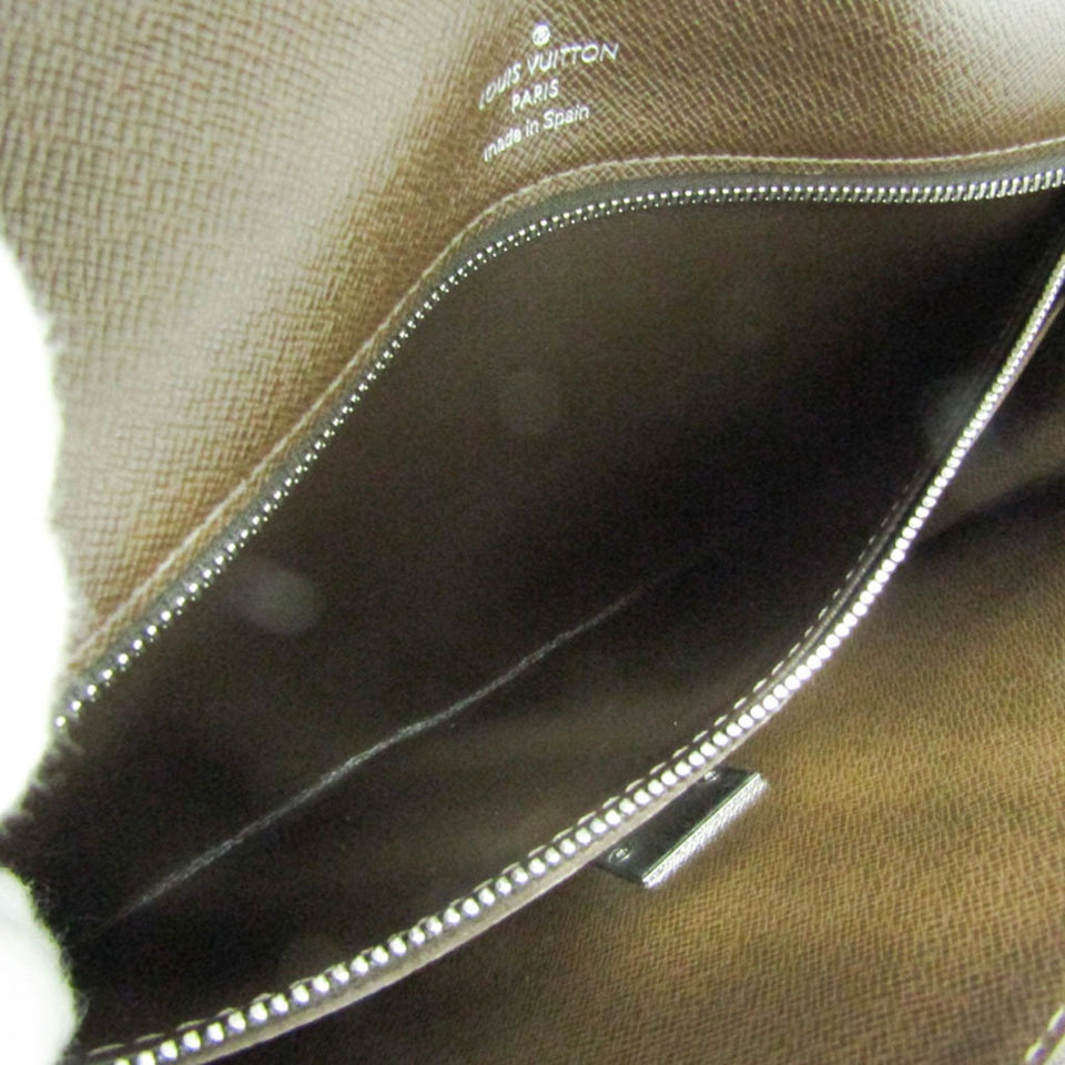 Louis Vuitton Selenga  Leather Clutch Bag