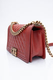 CHANEL Dark Orange Caviar Quilted Medium Boy Flap Bag