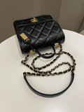 Chanel 22K Flap with Top Handle Black Caviar