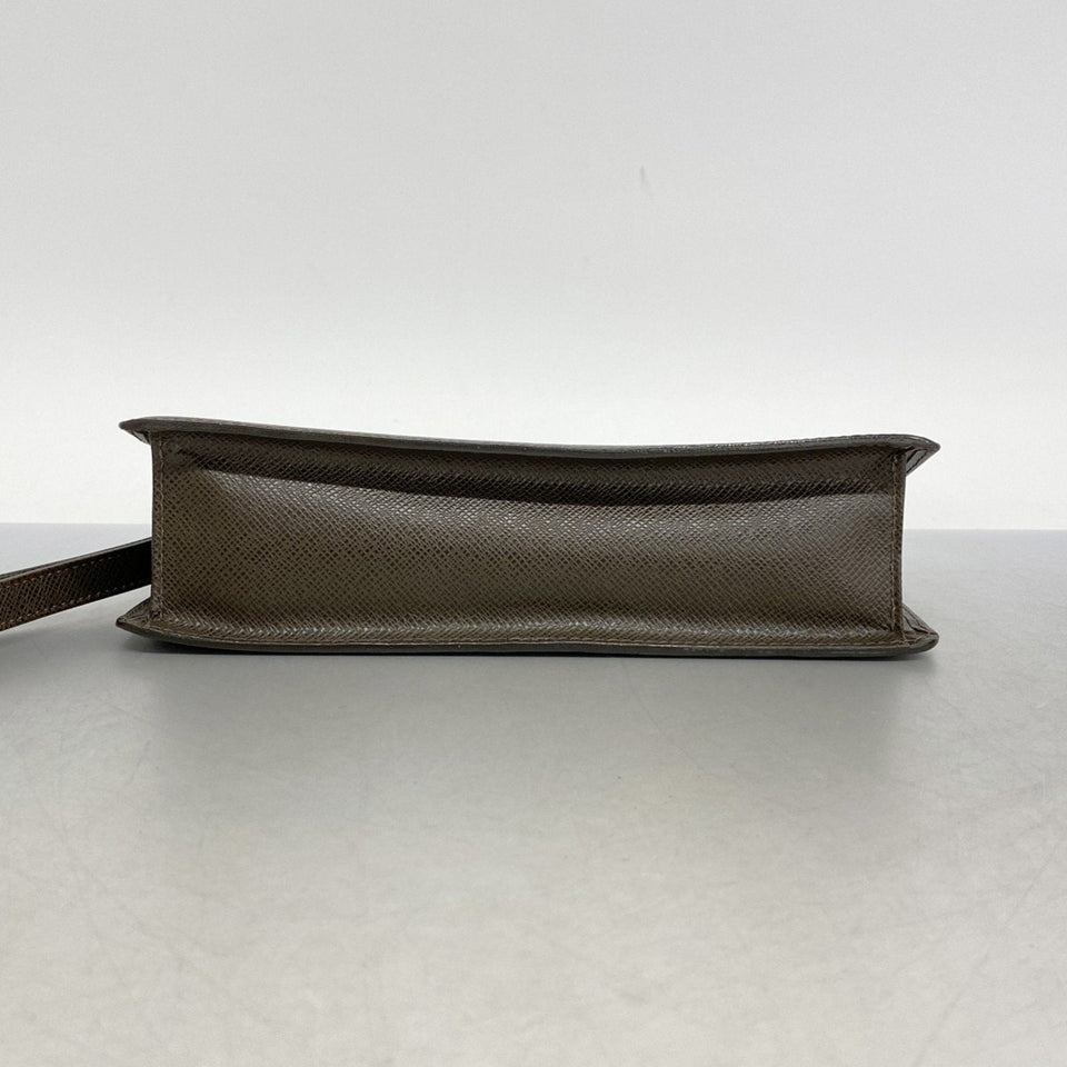 Louis Vuitton Selenga  Leather Clutch Bag